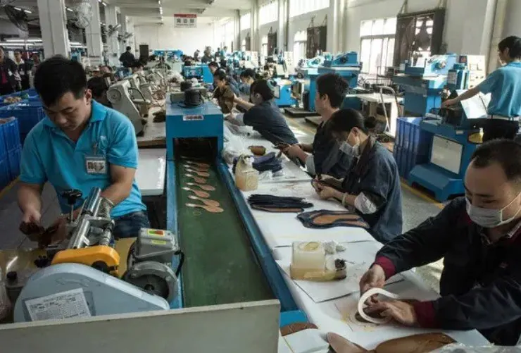 Shoe production equipment pictured in the original article; verify the actual factory separately