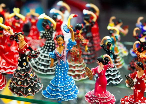 Painted flamenco dancer souvenir figurines with delicate raised arms and decorative dresses
